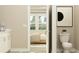 Ensuite bathroom leading to bedroom with bright natural light at 11546 Flourish Dr, Land O Lakes, FL 34637