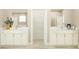 Bathroom showcasing double vanities, modern fixtures and a view into the walk-in closet at 11546 Flourish Dr, Land O Lakes, FL 34637