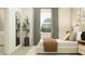 Bedroom featuring a bed with a brown throw and simple neutral decor at 11546 Flourish Dr, Land O Lakes, FL 34637