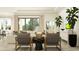 Cozy living room with modern furniture and large windows overlooking outdoor scenery at 11546 Flourish Dr, Land O Lakes, FL 34637