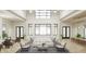 Grand lobby with soaring ceilings, modern decor, and abundant seating for guests and residents at 11730 Myakka Blue Dr, Venice, FL 34293