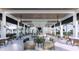 Spacious outdoor lounge area provides a social space with a fire pit and covered seating at 11730 Myakka Blue Dr, Venice, FL 34293