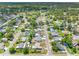 This aerial shows the neighborhood's tree-lined streets and well-maintained homes at 1213 W Camellia Dr, Brandon, FL 33510