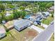 Aerial view showcasing a home with a fenced yard in a community with mature trees at 1213 W Camellia Dr, Brandon, FL 33510
