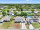 Aerial view of the home with mature trees and an extensive driveway at 1213 W Camellia Dr, Brandon, FL 33510