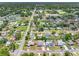An aerial view showcases the neighborhood with mature trees, pools and community features at 1213 W Camellia Dr, Brandon, FL 33510