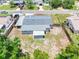 Aerial view of a house showing its new roof, fenced backyard, and neighborhood at 1213 W Camellia Dr, Brandon, FL 33510