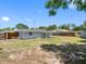 Spacious backyard with a partially covered patio, ready for entertaining and outdoor enjoyment at 1213 W Camellia Dr, Brandon, FL 33510