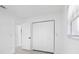 Cozy bedroom with bi-fold closet doors and modern light wood look floors at 1213 W Camellia Dr, Brandon, FL 33510