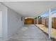 Attached carport featuring a concrete floor and support beams at 1213 W Camellia Dr, Brandon, FL 33510