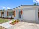 Well-maintained home featuring an attached garage, fresh exterior paint, and updated landscaping at 1213 W Camellia Dr, Brandon, FL 33510