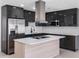 This modern kitchen features stainless steel appliances, an island and sleek cabinetry at 1213 W Camellia Dr, Brandon, FL 33510