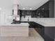 This sleek kitchen features stainless steel appliances, a modern island and cabinets at 1213 W Camellia Dr, Brandon, FL 33510