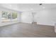 Bright living room boasts a large window, recessed lighting, and seamless flow into the adjacent rooms at 1213 W Camellia Dr, Brandon, FL 33510