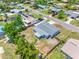 Aerial view of fenced-in rear exterior, highlighting new roof and neighborhood pool at 1213 W Camellia Dr, Brandon, FL 33510