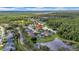 Stunning aerial shot showcasing homes surrounding a beautiful lake, complete with lush landscaping and tranquil waters at 12510 Loquat Way, Tampa, FL 33626