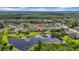 Great aerial view showcasing the house's location near a serene pond, surrounded by lush greenery at 12510 Loquat Way, Tampa, FL 33626