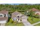 Gorgeous home, highlighted in an aerial shot, offering serene pond views at 12510 Loquat Way, Tampa, FL 33626