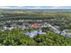 Serene aerial view of homes bordering a tranquil lake, offering a harmonious blend of nature and residential living at 12510 Loquat Way, Tampa, FL 33626