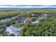 Scenic aerial view of homes located alongside a serene lake, providing a peaceful and picturesque setting at 12510 Loquat Way, Tampa, FL 33626