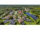 Aerial view showing the property's location near the pond and green space within the neighborhood at 12510 Loquat Way, Tampa, FL 33626