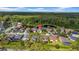 Aerial view of the house in a quiet community, highlighting its location near the pond and green landscapes at 12510 Loquat Way, Tampa, FL 33626