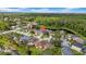 Beautiful aerial view of homes nestled in a serene community, surrounded by lush greenery and a tranquil lake at 12510 Loquat Way, Tampa, FL 33626