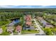 Beautiful aerial view showcasing the home's location near a tranquil pond, surrounded by lush greenery at 12510 Loquat Way, Tampa, FL 33626