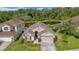 Aerial view of the charming home with its pond waterfront backyard at 12510 Loquat Way, Tampa, FL 33626