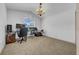 Bonus room features an oversized window, chandelier, and plenty of natural light at 12510 Loquat Way, Tampa, FL 33626