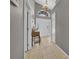 Bright foyer with tile flooring, a chandelier, and a view of the front door with sidelights at 12510 Loquat Way, Tampa, FL 33626