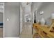 Inviting hallway featuring neutral paint, tile flooring, leading to dining, kitchen, and bedrooms at 12510 Loquat Way, Tampa, FL 33626
