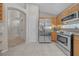 Open kitchen with stainless steel appliances and access to other rooms in the home at 12510 Loquat Way, Tampa, FL 33626