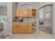 Kitchen features a granite countertop with custom cabinetry and a wine rack at 12510 Loquat Way, Tampa, FL 33626