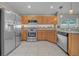 Spacious kitchen with stainless steel appliances, ample cabinet space, and tile flooring at 12510 Loquat Way, Tampa, FL 33626