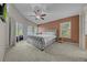 Main bedroom with a large window and sliding glass doors at 12510 Loquat Way, Tampa, FL 33626