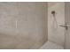 Stylish walk-in shower features sleek tile and a modern shower head at 12510 Loquat Way, Tampa, FL 33626
