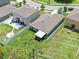 Aerial view of a single-Gathering home featuring a spacious fenced-in backyard, patio, and well-maintained lawn at 12907 Wildflower Meadow Dr, Riverview, FL 33579