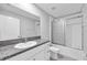 Bathroom features a granite-topped vanity, toilet, and shower with glass doors at 12907 Wildflower Meadow Dr, Riverview, FL 33579