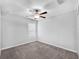 Bedroom with neutral carpet, ceiling fan, and a bright window at 12907 Wildflower Meadow Dr, Riverview, FL 33579