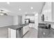 Spacious kitchen boasting granite countertops, stainless steel appliances, and white cabinetry at 12907 Wildflower Meadow Dr, Riverview, FL 33579