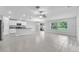 Bright living space with tile floors, kitchen, and an adjoining dining area offers an open layout at 12907 Wildflower Meadow Dr, Riverview, FL 33579