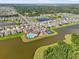 An aerial view of the community including neighborhood pools, tennis courts and playgrounds at 13157 Peachleaf Ave, Riverview, FL 33579