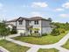 Well-manicured lawn and sidewalk lead to the front of this home at 13157 Peachleaf Ave, Riverview, FL 33579