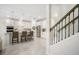 Bright kitchen with stainless steel appliances, white cabinetry, and island with seating at 13157 Peachleaf Ave, Riverview, FL 33579