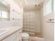 Bright bathroom featuring a glass block shower and modern fixtures at 14045 90Th Pl, Seminole, FL 33776