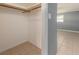 Bedroom closet with tile flooring and open shelving at 14045 90Th Pl, Seminole, FL 33776
