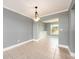 Dining room features tile flooring, modern light fixture and view to the backyard at 14045 90Th Pl, Seminole, FL 33776