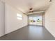 Spacious garage with gray flooring and a window provides natural light at 14045 90Th Pl, Seminole, FL 33776