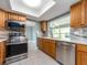 Beautiful kitchen with stainless steel appliances, marble countertops, and bright natural light at 14045 90Th Pl, Seminole, FL 33776